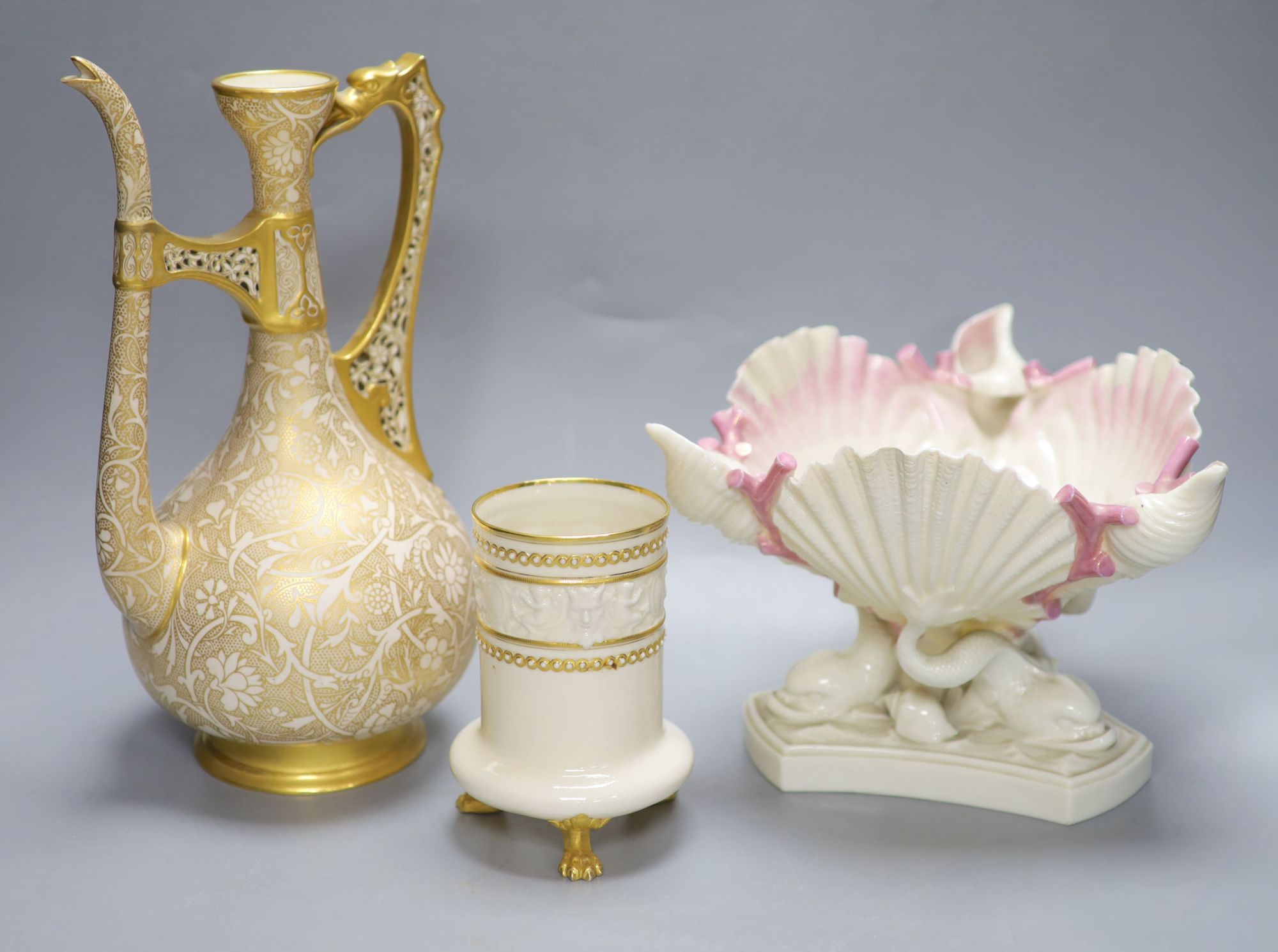 A Royal Worcester ewer, in the Persian style, a shell and dolphin centrepiece and a vase, tallest 30cm